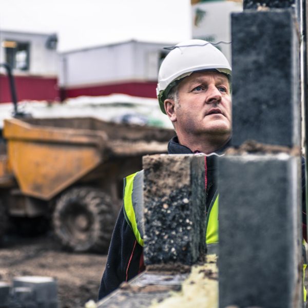 workers-laying-bricks-on-construction-site-2022-03-07-23-57-27-utc